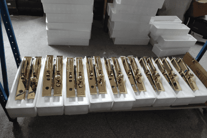 Organized packing of luxury door handles for delivery.